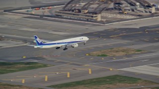 5.5K aerial stock footage of a commercial jet approaching and landing at JFK Airport in Autumn Aerial Stock Footage | AX120_068E