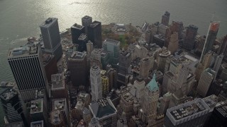 AX120_107 - 5.5K aerial stock footage orbit skyscrapers and Battery Park in Lower Manhattan, New York City