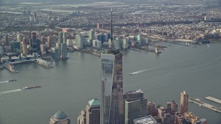 5.5K aerial stock footage orbit One World Trade Center in Lower Manhattan, Jersey City in the background, New York City Aerial Stock Footage | AX120_116