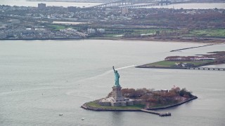 5.5K aerial stock footage of a wide orbit of the Statue of Liberty in Autumn, New York Aerial Stock Footage | AX120_119E