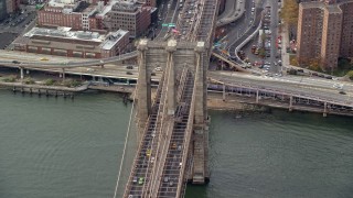 AX120_136 - 5.5K aerial stock footage orbit heavy traffic on the Brooklyn Bridge, New York City