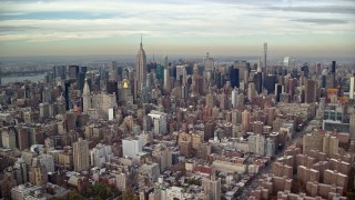 5.5K aerial stock footage approach Midtown from East Village in Autumn, New York City Aerial Stock Footage | AX120_154E