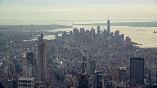 AX120_169E - 5.5K aerial stock footage of the Empire State Building and Lower Manhattan, New York City