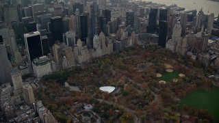 AX120_234 - 5.5K aerial stock footage approach Wollman Rink in Central Park in Autumn, New York City