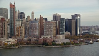 AX120_249 - 5.5K aerial stock footage of Battery Park and riverfront high-rises in Autumn, Lower Manhattan, New York City