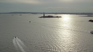 5.5K aerial stock footage of a wide view of the Statue of Liberty in Autumn, New York Aerial Stock Footage | AX120_250