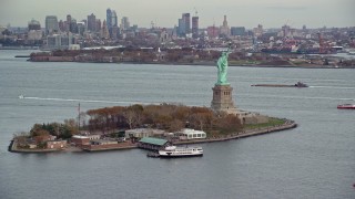 AX120_262 - 5.5K aerial stock footage orbit Liberty Island and Statue of Liberty in Autumn, New York