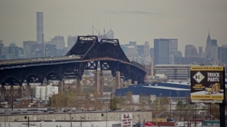 5.5K aerial stock footage of a small bridge connecting Kearny with Jersey City in Autumn, New Jersey Aerial Stock Footage | AX120_275