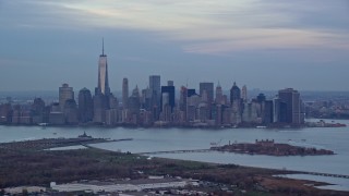 5.5K aerial stock footage of the Lower Manhattan skyline at twilight in Autumn, New York City Aerial Stock Footage | AX121_010E