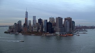 AX121_018E - 5.5K aerial stock footage of Battery Park and Lower Manhattan at twilight, New York City