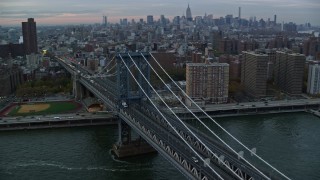 5.5K aerial stock footage orbit Manhattan Bridge at twilight in New York City Aerial Stock Footage | AX121_041