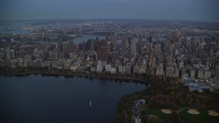 5.5K aerial stock footage orbit Upper East Side skyscrapers near Central Park at twilight in New York City Aerial Stock Footage | AX121_096