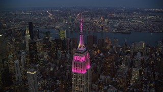 5.5K aerial stock footage orbit top of Empire State Building at twilight in Midtown, New York City Aerial Stock Footage | AX121_108