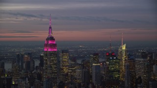 5.5K aerial stock footage of the Empire State Building at twilight in Midtown, New York CIty Aerial Stock Footage | AX121_111E