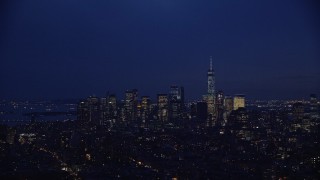 5.5K aerial stock footage approach Lower Manhattan skyline at Night in New York City Aerial Stock Footage | AX121_153E