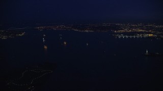 5.5K aerial stock footage of ships on New York Harbor at Night Aerial Stock Footage | AX121_165E