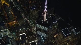 AX121_176 - 5.5K aerial stock footage of flying away from One World Trade Center at Night in Lower Manhattan, New York City