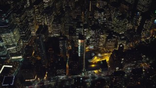 5.5K aerial stock footage of a bird's eye view of Lower Manhattan at Night, New York City Aerial Stock Footage | AX121_182