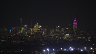 5.5K aerial stock footage of the Midtown Manhattan skyline in NYC seen from Jersey City at Night Aerial Stock Footage | AX121_204