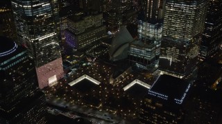 AX122_045E - 5.5K aerial stock footage orbit World Trade Center Memorial, Lower Manhattan at Night in New York City