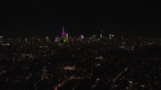 5.5K aerial stock footage of Midtown skyscrapers seen from Lower East Side at Night in NYC Aerial Stock Footage | AX122_067E