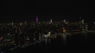 5.5K aerial stock footage orbit Midtown Manhattan skyscrapers at Nighttime in NYC Aerial Stock Footage | AX122_076E