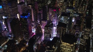 5.5K aerial stock footage of Midtown Manhattan skyscrapers by Times Square at Night in NYC Aerial Stock Footage | AX122_127