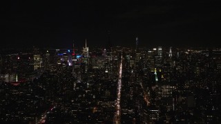 5.5K aerial stock footage of dark Empire State Building and Midtown skyscrapers at Night, New York City Aerial Stock Footage | AX122_147E