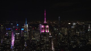 5.5K aerial stock footage approach the Empire State Building at Night in Midtown Manhattan, New York City Aerial Stock Footage | AX122_151E