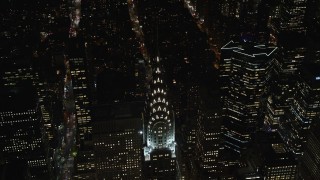 5.5K aerial stock footage of orbiting the top of the Chrysler Building at Nighttime in Midtown, New York City Aerial Stock Footage | AX122_160E