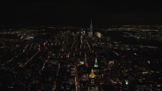 5.5K aerial stock footage approach Lower Manhattan from Midtown at Night in New York City Aerial Stock Footage | AX122_164E