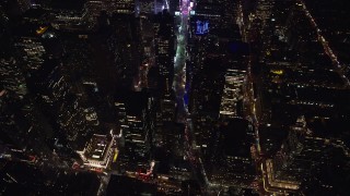 5.5K aerial stock footage approach and tilt to Broadway in Midtown Manhattan, New York City at Night Aerial Stock Footage | AX122_184