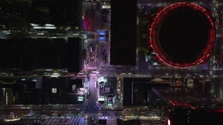 AX122_189E - 5.5K aerial stock footage of light traffic on 7th Ave, reveal Madison Square Garden in Midtown, NYC at Night