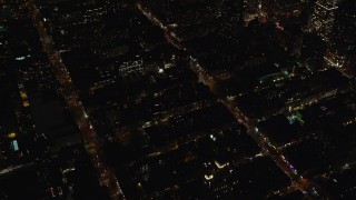 5.5K aerial stock footage orbit Hell's Kitchen streets and apartments at Night in Midtown Manhattan, New York City Aerial Stock Footage | AX122_216E