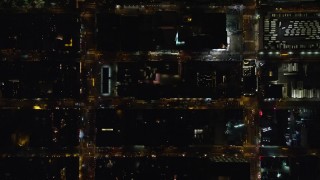 5.5K aerial stock footage bird's eye view of Hell's Kitchen streets at Night in Midtown Manhattan, New York City Aerial Stock Footage | AX122_219E