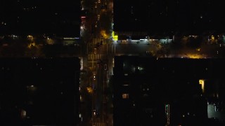 5.5K aerial stock footage of a bird's eye of cars traveling on 2nd Avenue at Night in East Village, New York City Aerial Stock Footage | AX122_235E