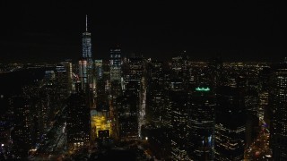 AX122_282E - 5.5K aerial stock footage orbit riverfront towers and reveal Freedom Tower in Lower Manhattan at Night, NYC