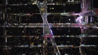 AX123_066E - 5.5K aerial stock footage of a bird's eye of 6th Avenue and Broadway at Night in Midtown, New York City