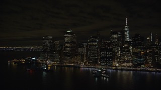 5.5K aerial stock footage of riverfront skyscrapers in Lower Manhattan at Night in New York City Aerial Stock Footage | AX123_107E