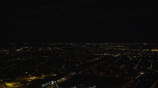 AX123_145E - 5.5K aerial stock footage of residential neighborhoods at Night in Jamaica, New York