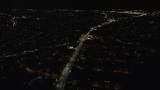 5.5K aerial stock footage approach and orbit Nassau Road and suburban homes at Night in Uniondale, New York Aerial Stock Footage | AX123_165E