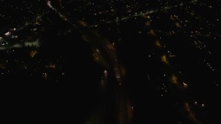 5.5K aerial stock footage of a reverse view of suburban homes at Night in Merrick, New York Aerial Stock Footage | AX123_170E