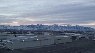 5.5K aerial stock footage of the Wasatch Range seen from SLC International Airport in Winter at Sunrise, Utah Aerial Stock Footage | AX124_001E