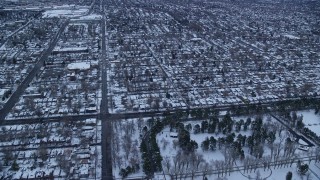 5.5K aerial stock footage fly over Liberty Park and suburbs at Sunrise in Winter, Salt Lake City, Utah Aerial Stock Footage | AX124_013E