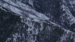 5.5K aerial stock footage of a snowy mountain ridge in Winter at Sunrise, Wastach Range, Utah Aerial Stock Footage | AX124_036E