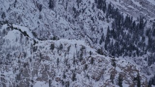 5.5K aerial stock footage approach snowy summit of Mount Olympus at winter sunrise, Utah Aerial Stock Footage | AX124_047