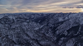 5.5K aerial stock footage of snowy Wasatch Range mountains in winter at sunrise in Utah Aerial Stock Footage | AX124_051