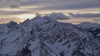 5.5K aerial stock footage approach Wasatch Range mountains with winter snow at sunrise in Utah Aerial Stock Footage | AX124_057E