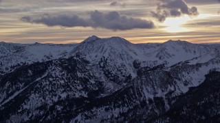 5.5K aerial stock footage approach peaks with winter snow in Wasatch Range at sunrise in Utah Aerial Stock Footage | AX124_066