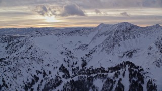 5.5K aerial stock footage of mountains with winter snow at sunrise in Wasatch Range, Utah Aerial Stock Footage | AX124_071